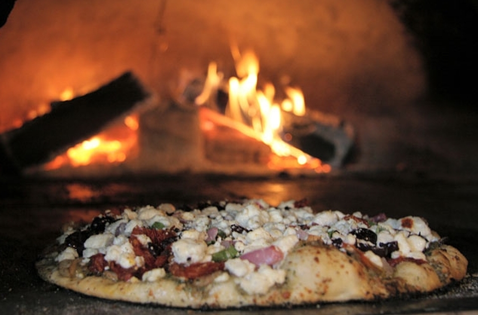 Menu - Trio A Brick Oven Cafe Italian Restaurant Downtown Greenville SC - pizza entering the wood-fired brick oven